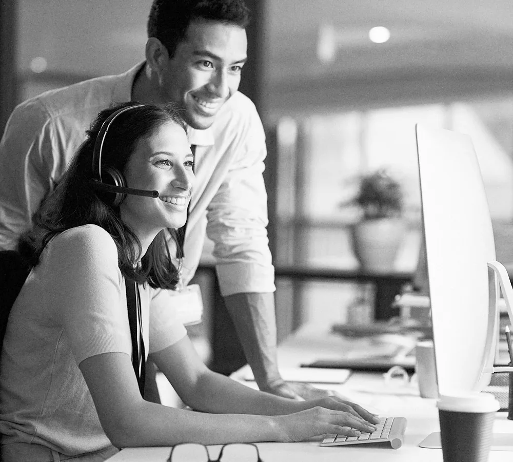 Two people looking at a computer screen