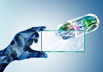 A hand overlayed with cells hold a slide with ones and zeros on it to represent artificial intelligence code. Behind and above the slide with the code is a multi-colored pill.