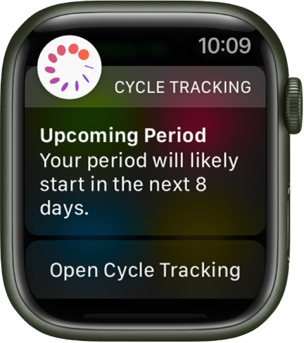 Ura Apple Watch prikazuje zaslon napovedi cikla, na katerem piše »Upcoming Period. Your period will likely start in the next 8 days.« (Prihajajoča menstruacija. Vaša menstruacija se bo verjetno začela v naslednjih 8 dnevih.) Na dnu je prikazan gumb Open Cycle Tracking (Odpri spremljanje cikla).