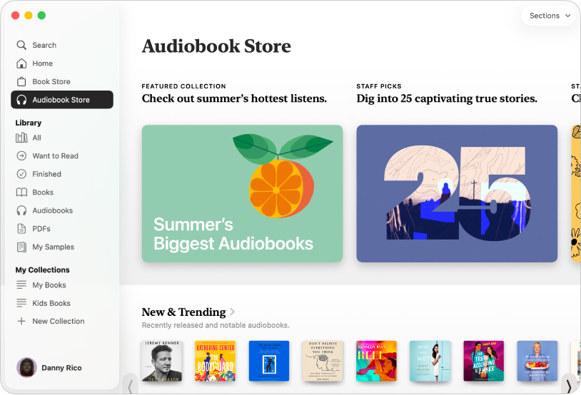 O fereastră din aplicația Cărți, afișând fila Audiobook Store selectată în bara laterală, cu categorii de titluri în dreapta, inclusiv „New & Trending”.
