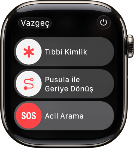 Apple Watch ekranı Tıbbi Kimlik, Pusula Geriye Dönüş ve Acil Arama sürgülerini gösteriyor. Güç düğmesi sağ üstte.