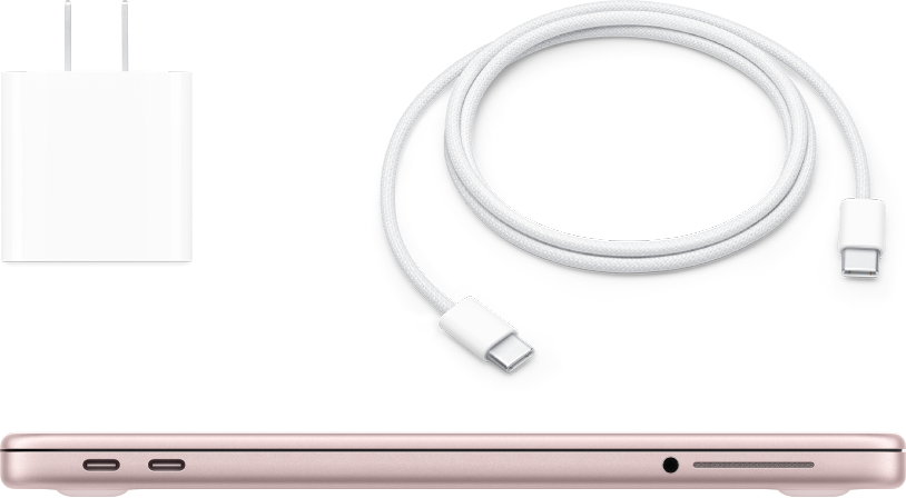 Ein geschlossenes MacBook Neo mit Netzteil und Ladekabel.