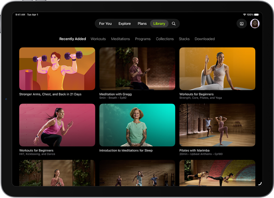 The Library screen in Apple Fitness+ showing workouts, meditations, and programs. A row of categories is at the top of the screen.