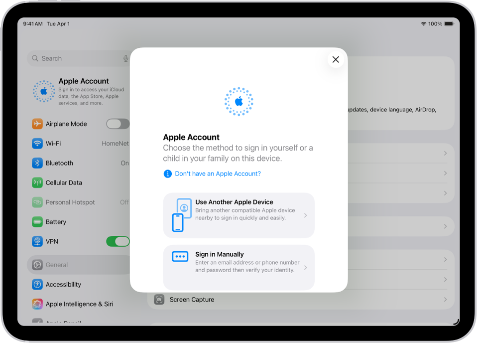 Asetukset-näyttö ja Apple-tilin kirjautumisikkuna näytön keskellä.