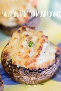 stuffed mushrooms with cheese and green peppers on a blue and yellow table cloth next to other food items
