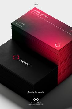 some business cards stacked on top of each other with the company logo in red and black