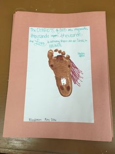 a child's handprint with a giraffe on it