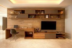 a modern home office with wooden shelves and desks