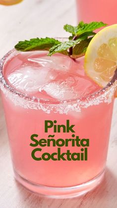 pink lemonade cocktail with mint garnish on the rim