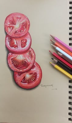 a drawing of tomatoes stacked on top of each other with colored pencils next to it