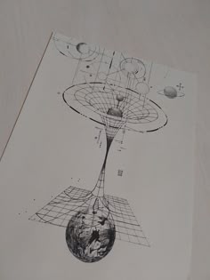 an image of a drawing on top of a piece of paper with lines and planets