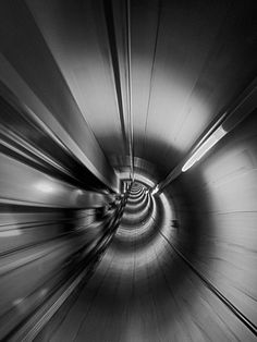 a black and white photo of a tunnel