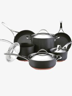 an assortment of pots and pans on a white background with the lids down,