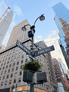 the street signs are clearly visible for everyone to see on this city's streets
