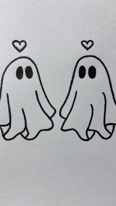 two ghost faces with hearts drawn on them
