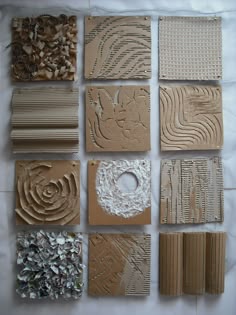 several pieces of cardboard are laid out on a sheet of white paper and placed together