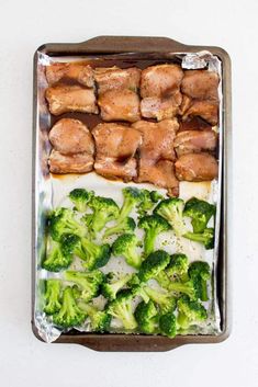 chicken and broccoli on a baking sheet