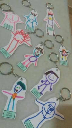 several different key chains with pictures of people on them