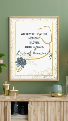 a framed medical art print on the wall above a cabinet with candles and vases