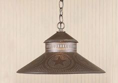 a light hanging from a ceiling in a room