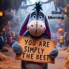 a donkey holding a sign that says, good morning you are simply the best