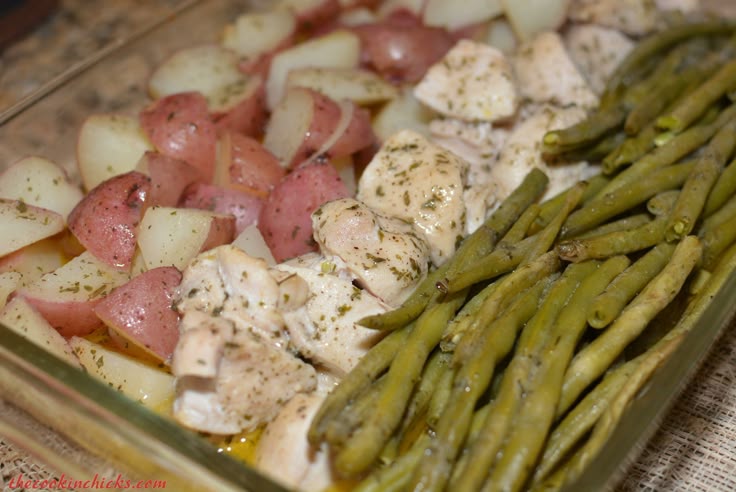 chicken, asparagus and potatoes in a casserole dish