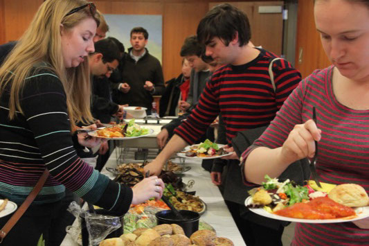 Debaters getting lunch catered by Club 86