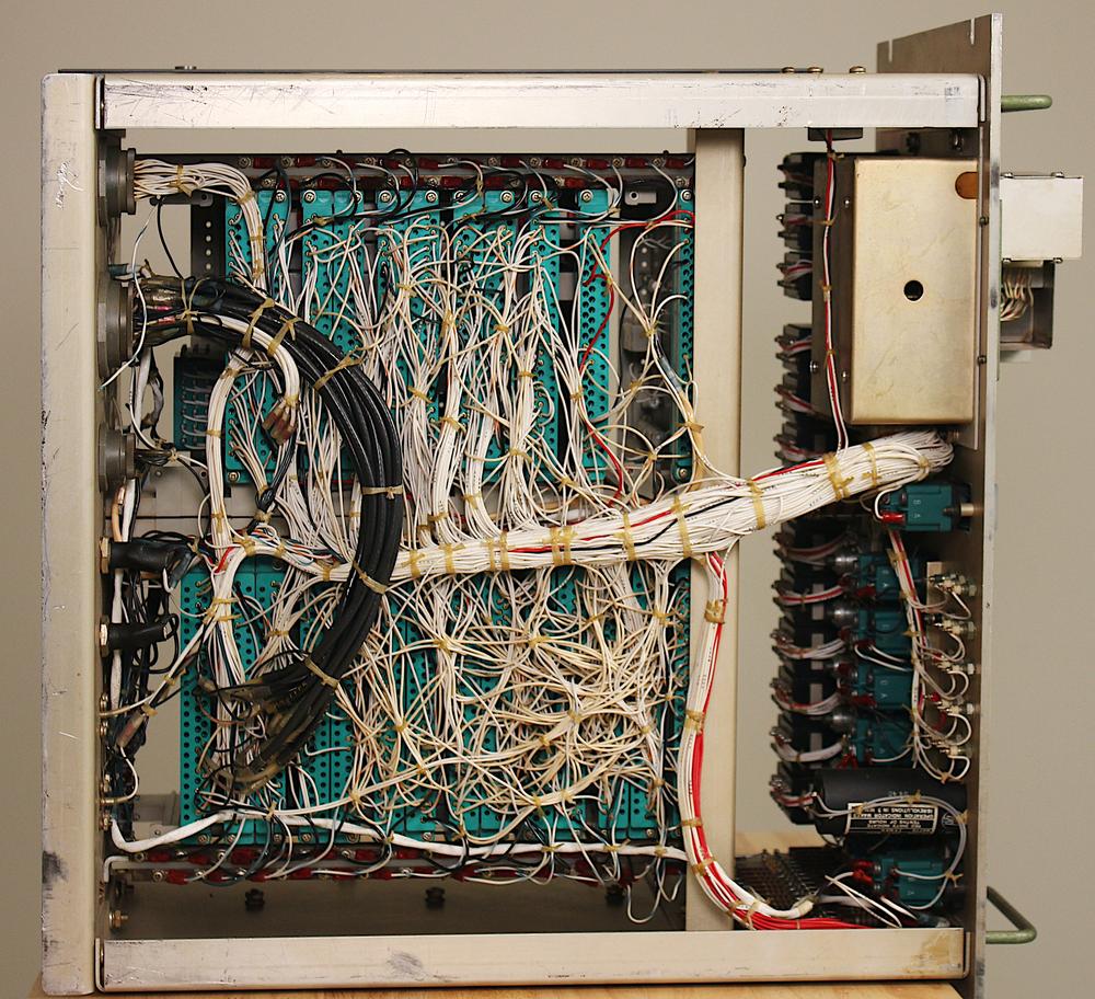 The backplane wiring of the Test Set consisted of bundles of white wires, as shown in this view of the underside of the Test Set. The backplane wiring of the Test Set consisted of bundles of white wires, as shown in this view of the underside of the Test Set.