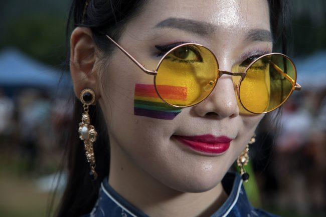 Participant Nae-Gyeol Song poses for a photo during a 'Gay Pride' gathering in Seoul on July 15, 2017. Thousands of people celebrated gay rights with song, dance and a march in Seoul on July 15, amid rain and boisterous protests by conservative Christians. Religious South Koreans have been a loud fixture at the annual parade for years, holding a rival anti-homosexuality rally while trying to physically block the march. / AFP PHOTO / Ed JONES (Photo credit should read ED JONES/AFP/Getty Images)