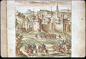 A Cavalry charge as people flee back towards a city