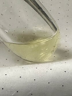 A sample of liquefied ketene (ethenone) at -60 °C, yellow due to polymerization