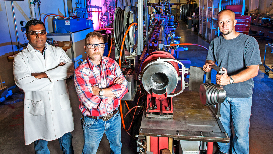 Engineers working on a piece of equipment.